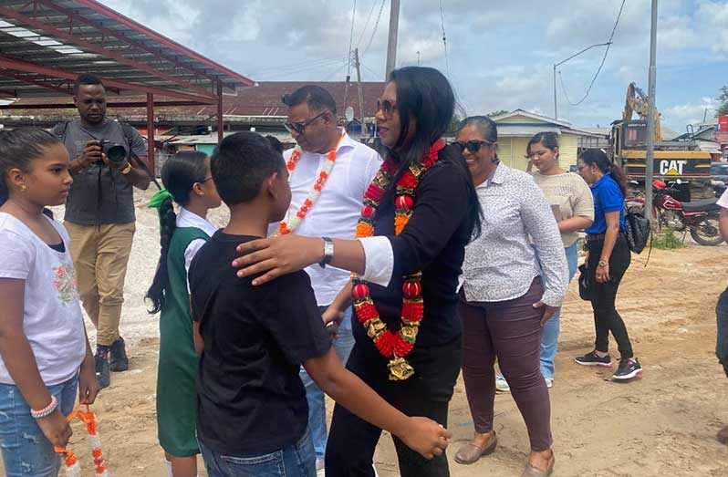 Minister of Local Government and Regional Development Sonia Parag and Minister within the Ministry of Public Works Deodat Indar being warmly received on arriving at the new Charity Market, which is under construction