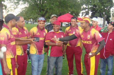 Hemnarine Chattergoon is rewarded by his teammates for his brilliant innings.