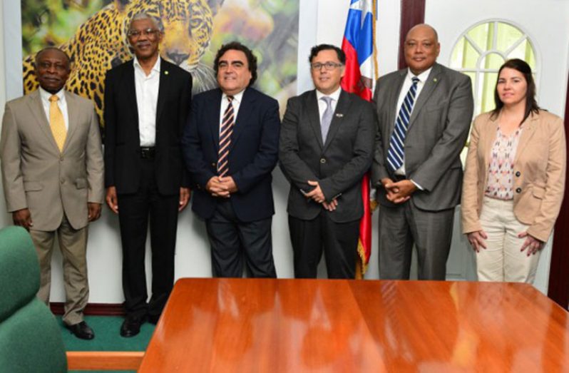 President Granger poses with (from left) Minister of Foreign Affairs, Mr. Carl Greenidge; Chilean Ambassador, Mr. Claudio Rachel Rojas; Project Manager of the visiting team from Sernageomin, Dr. Juan Pablo Lacassie; Minister of Natural Resources, Mr. Raphael Trotman and Geologist from Sernageomin, Ms. Miriela Santana