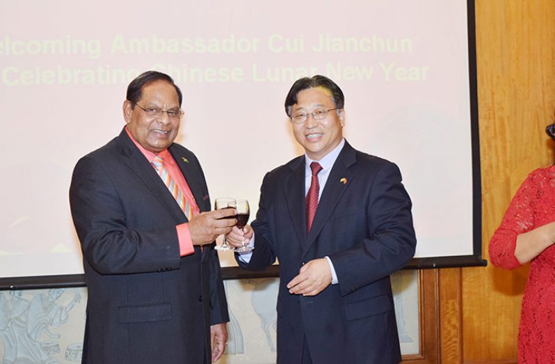 Chinese Ambassador to Guyana 
H.E. Cui Jianchun and Prime Minister, Moses Nagamootoo toast to the occasion of the Chinese New Year (Cullen Bess-Nelson photo)