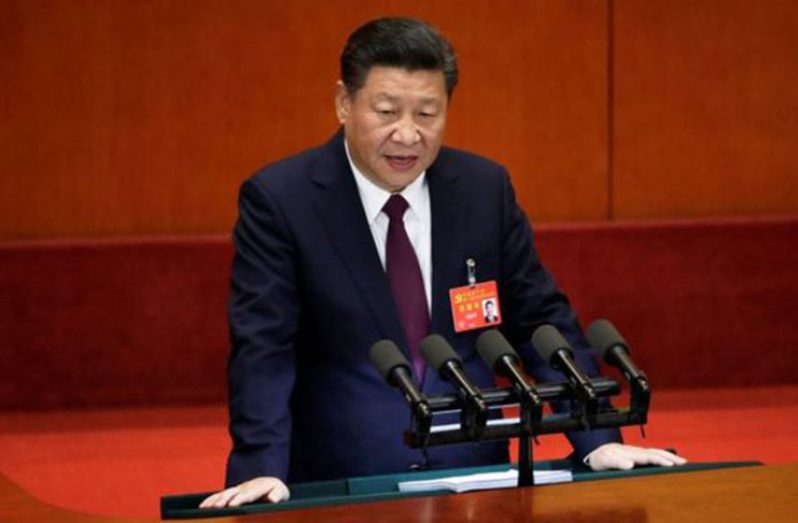 Mr Xi addressing delegates at the start of the week-long meeting (Photo courtesy Reuters)