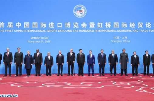 Chinese President Xi Jinping takes group photos with foreign leaders before the opening ceremony of the first China International Import Expo in Shanghai, east China