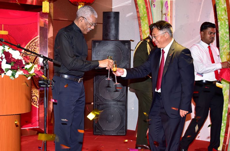 President David Granger and Chinese Ambassador, Mr. Cui Jianchun toast to the friendly relations between Guyana and China (MoTP photo)