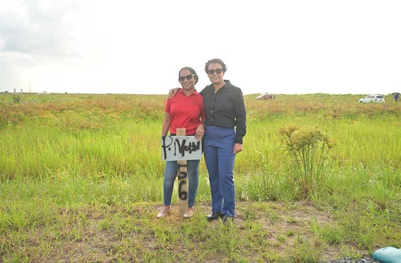 Allottee Nikita Mohabir with Minister within the Ministry of Housing and Water Susan Rodrigues