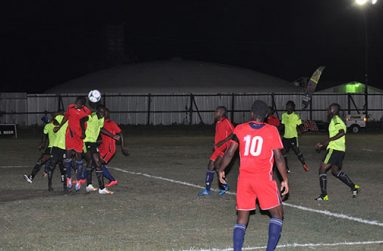 Battle in the air between Grove Hi Tech (green) and Buxton United.