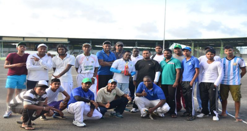 The opposing teams share smiles after GNNL trample GBTI by 48 runs. (Photo by Adrian Narine)