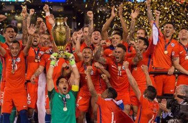 Claudio Bravo of Chile hoists the trophy after defeating Argentina to win the Copa America Centenario.