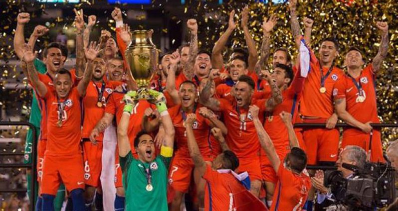 Claudio Bravo of Chile hoists the trophy after defeating Argentina to win the Copa America Centenario.