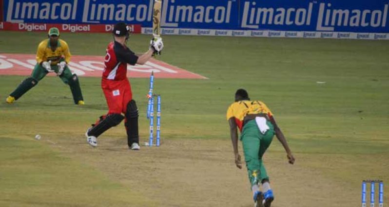 Got him! Guyana Amazon Warriors’ fast bowler Ronsford Beaton shatters the stumps of Red Steel’s Kevin O’Brien with the first ball of that team’s final over last night. The wicketkeeper is Denesh Ramdin. (Photo by Adrian Narine)