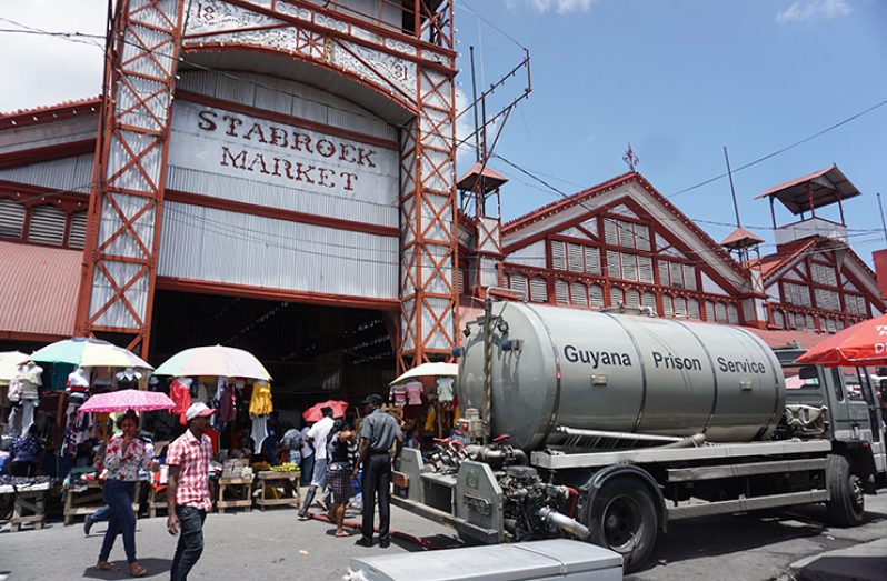 The Guyana Fire Service lends a hand to the exercise by supplying water