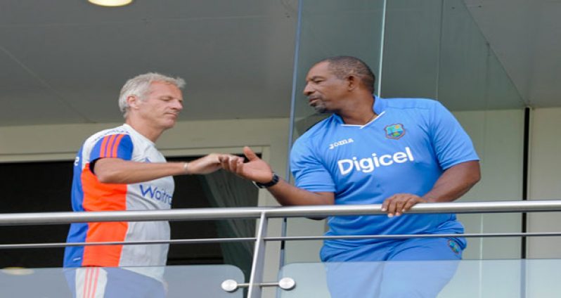 West Indies head coach Phil Simmons (right) is congratulated by opposite number (Photo courtesy WICB Media)