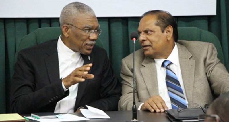President David Granger and Prime Minister Moses Nagamootoo are seen engaged in light discussion in this Ministry of the Presidency file photo (December 30, 2015)