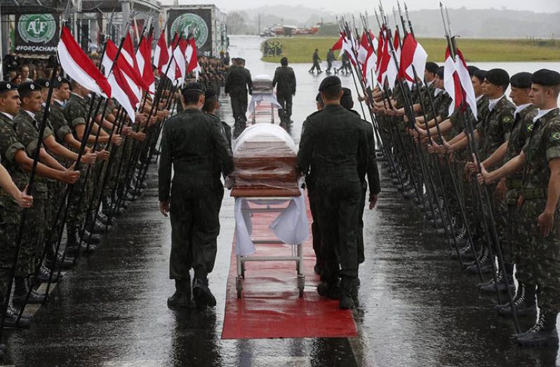 The coffins of the Chapecoense soccer team members, who died in a plane crash in northwestern Colombia last week