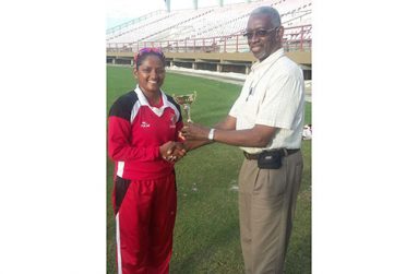 Anisa Mohammed collects her Player-of-the-Match trophy from Grantley Culbard.