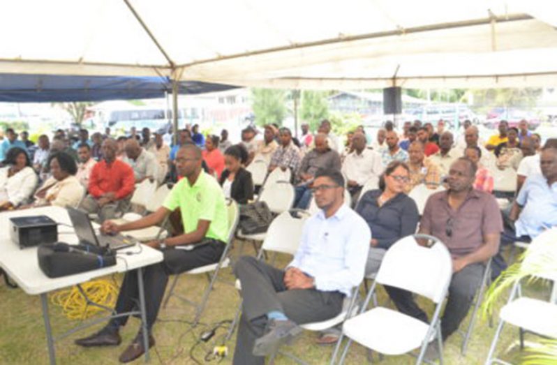 Small contractors, evaluators and members of the Regional Tender board at the procurement and project implementation workshop on the State House lawns in New Amsterdam, Berbice