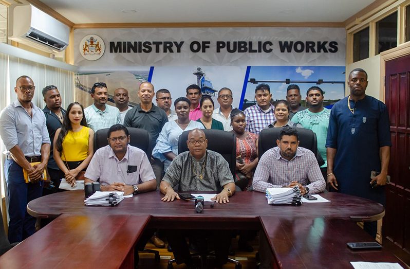 Minister of Public Works, Juan Edghill; Permanent Secretary, Vladim Persaud and Procurement Manager, Andy Mahadeo, along with contract awardees