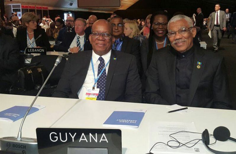 President David Granger and Minister of Finance, Mr. Winston Jordan participating in the High Level Segment (HLS) of the Twenty Second Conference of Parties of the United Nations Framework Convention on Climate Change. Immediately behind the President is Head of the Department of the Environment, Mrs. Ndibi Schwiers-Ceres