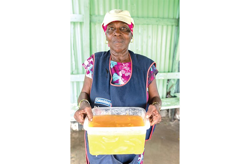 Coreen Elias displaying her mango pickle for sale