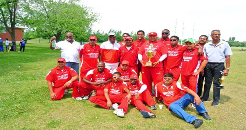 The winning Cricketers Cove team pose after their victory over Dant. OSCL president Albert Ramcharran is at extreme right.