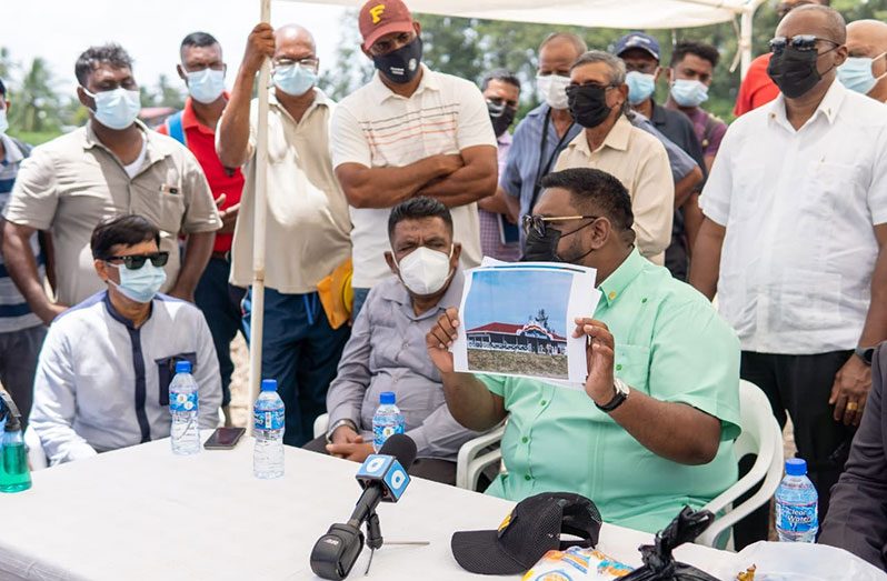 President Ali explaining the crematorium project to some of the residents of Leguan