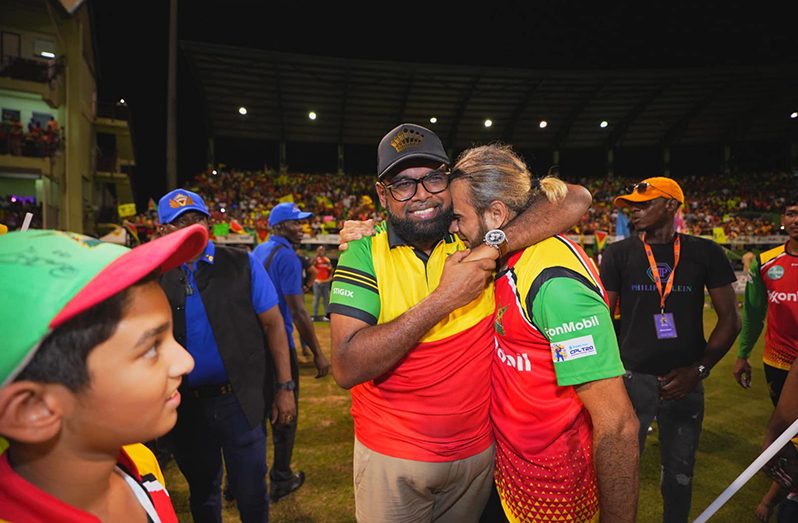 : President, Dr. Irfaan Ali embraces captain of the Guyana Amazon Warriors Imran Tahir (Office of the President)