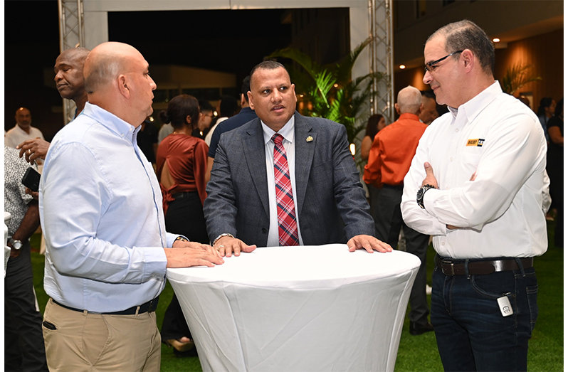 Minister Croal interacts with company officials