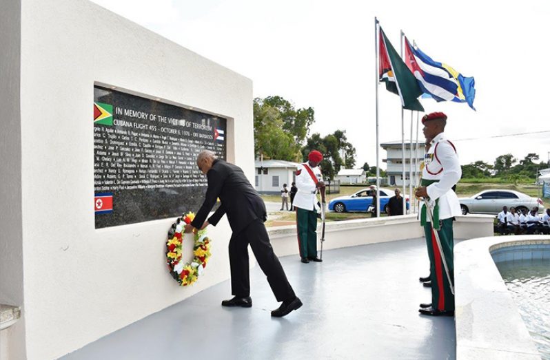 Flashback! President David Granger back in 2016 laid a wreath at the monument erected at the Turkeyen Campus to remember the victims of the October 1976 terrorist attack