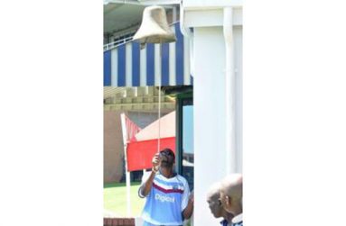 Legendary former fast bowler Curtly Ambrose rings the bell during the tribute to Nelson Mandela. (Photo courtesy WICB Media)