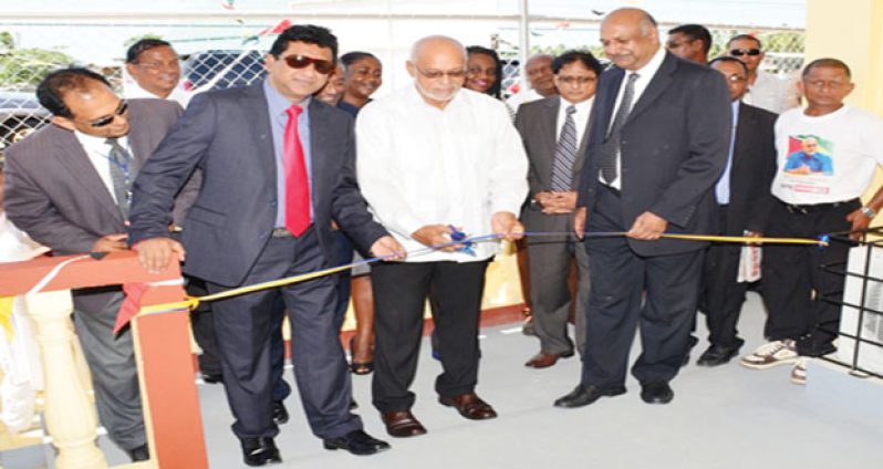 President Donald Ramotar cuts the ribbon to commission the new Number 51 Village Magistrate’s Court, Region6. On his right is Attorney General, Anil Nandlall and on his left are Justice B.S. Roy and Chancellor of the Judiciary (ag) Carl Singh. Other legal personalities are also in photo 