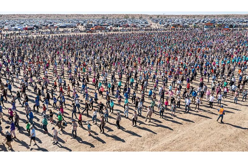 Almost 6,000 people took to the dusty dance floor at the Birdsville Big Red Bash to break the world record for the number of people doing the Nutbush (Matt William photo)