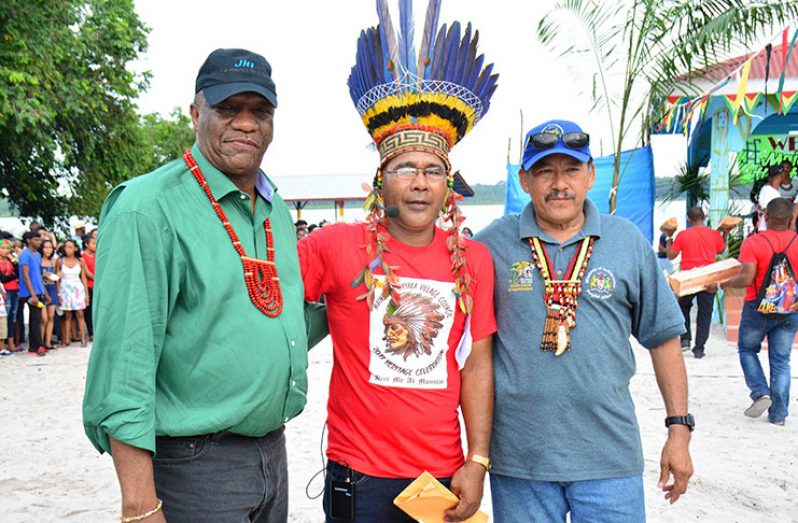 Minister of State, Mr. Joseph Harmon, Toshao Joel Fredericks and Vice President and Minister of Indigenous Peoples' Affairs, Mr. Sydney Allicock share a photo opportunity during the celebration.
