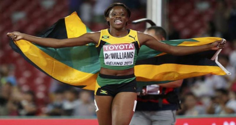 Jamaica's Danielle Williams wins the world championship 100 metres hurdles gold as her more experienced rivals crumble under pressure, yesterday.