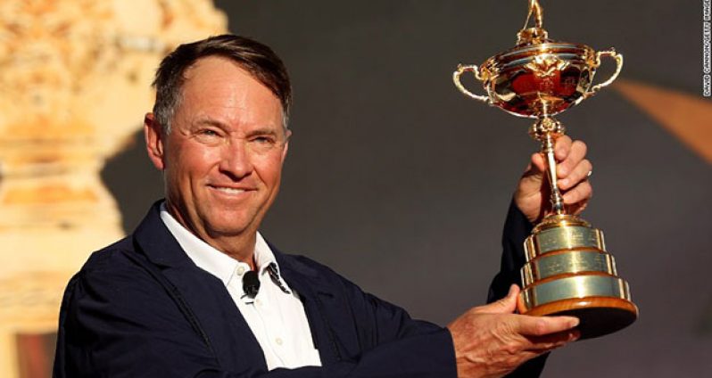 USA captain Davis Love III holds the Ryder Cup aloft after his team beat Europe in the 2016 edition.