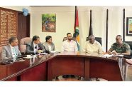 Minister of Home Affairs, Robeson Benn; Permanent Secretary, Mr. Andre Ally; Acting Chief of Defence Staff and Director of the National Intelligence and Security Agency (NISA), Colonel Sheldon Howell; Charis Griffith, Acting Director of the Guyana Forensic Science Laboratory (GFSL), in discussion with India’s National Forensic Sciences University (NFSU) officials, at the Ministry of Home Affairs