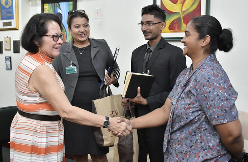 First Lady, Mrs. Sandra Granger (left) greets Director of Demerara Bakery, Mrs. Sharmella Chan-Abai. Also in photo are: CEO of the Bakery Mrs. Marissa DaCosta - Thakurdin (second left), and Human Resource and Marketing Manager, Mr. Davindra Lalltoo (second right).