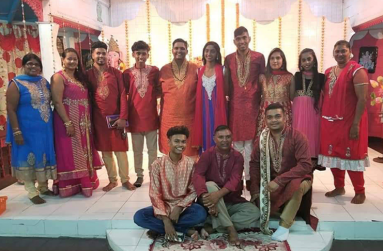 Deodat Persaud alongside members of the Golden Om Dharmic Youth Organisation