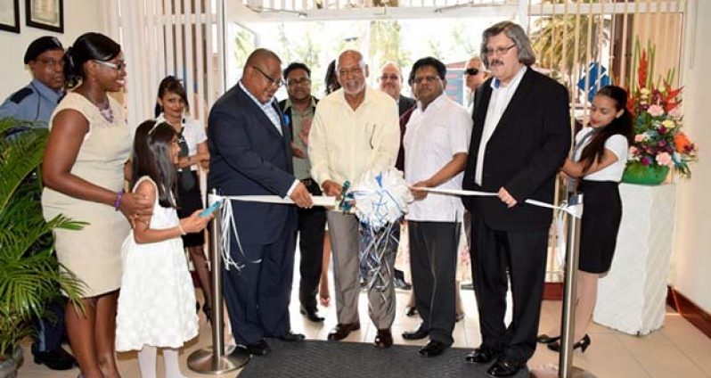 President Donald Ramotar, Finance Minister, Dr. Ashni Singh, Member of the Board of Director, Derwin Howell and  Managing Director Republic Bank Limited, John Alves during the symbolic ribbon cutting ceremony for the opening the D’Edward Village Republic Bank branch 