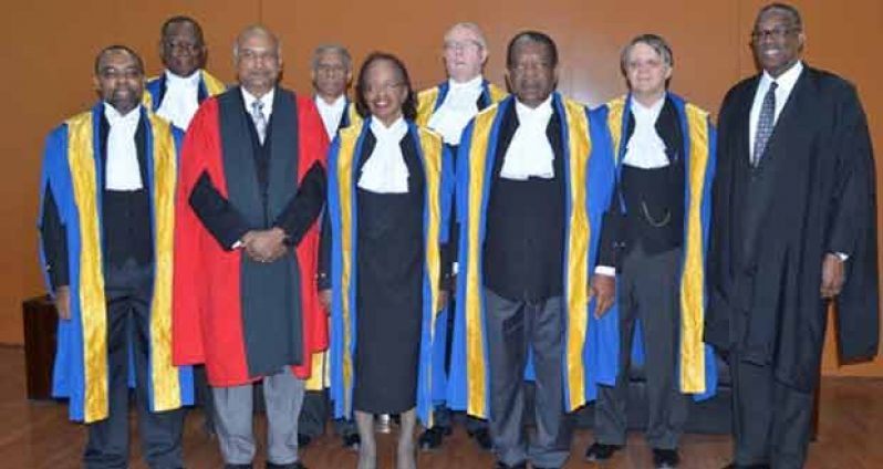 Honouree Justice Desiree Bernard flanked by Chancellor of the Judiciary, Justice Carl Singh, at left, and President of the Caribbean Court of Justice (CCJ) Sir Charles Dennis Byron, along with other Caribbean Court of Justice judges.