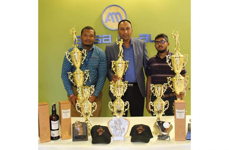 Ansa McAL Corporate Communications Officer, Treiston Joseph; LGC president Aleem Hussain and Dewars Rum Brand Co-ordinator, Timothy Sammy display this weekend’s spoils.