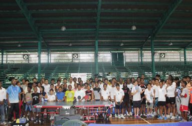 Digicel’s Gavin Hope, Minister of Sport Dr Frank Anthony, GTTA’s president Godfrey Munroe and National table tennis coach Linden Johnson (all in front row, seated) pose with all the school children at the closing ceremony of the Digicel-sponsored tournament.