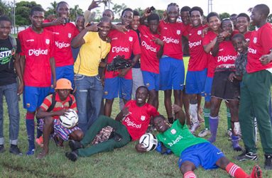 The victorious St Mary’s team celebrate after their 4-2 win over St Stanislaus College. (Stephan Sookram photo)