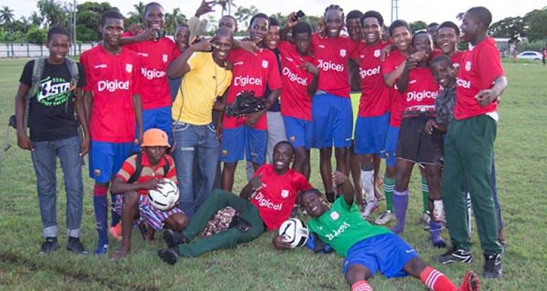 The victorious St Mary’s team celebrate after their 4-2 win over St Stanislaus College. (Stephan Sookram photo)