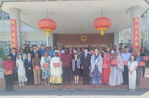 Chinese Ambassador Yang Yang (centre) next to Acting Permanent Secretary of the Ministry of Health, Dr. Cerdel McWatt, flanked by officials and participants of the programme