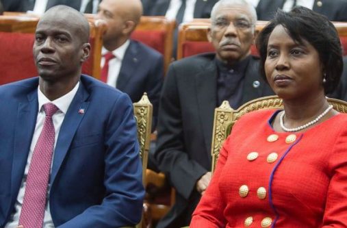Haiti's President Jovenel Moise sits with his wife Martine during his swearing-in ceremony at Parliament in Port-au-Prince, Haiti on Tuesday. In background is President David Granger, who is also Chairman of Caricom
