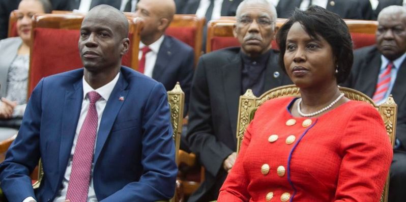 Haiti's President Jovenel Moise sits with his wife Martine during his swearing-in ceremony at Parliament in Port-au-Prince, Haiti on Tuesday. In background is President David Granger, who is also Chairman of Caricom