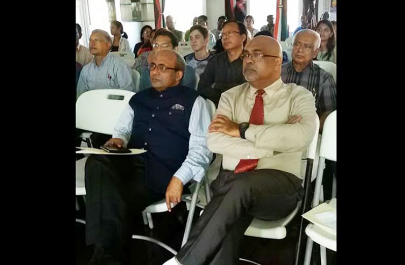 India’s Ambassador to Guyana Venkatachalam Mahalingam (left) and Indian Action Committee (IAC) Executive Member Neaz Subhan, sit among the audience at Pravasi Bharatiya Devas held at the India Cultural Centre