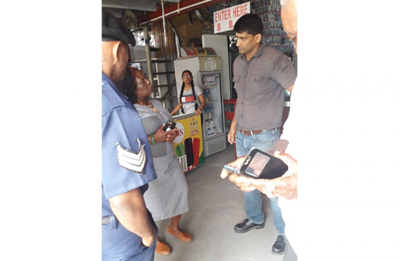 Mayor Winifred Haywood in discussion with a business owner