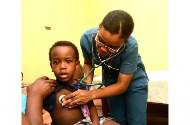 Dr Alfred taking care of one on her patients
