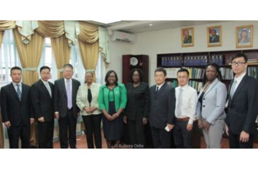 From left: Guo Huaiguang-Second secretary of Chinese Embassy, Shen Huiyong-Economic and Commercial counsellor of Chinese Embassy, Zhang Yanping-Leader of Chinese Public health experts team; Minister Volda Lawrence; Dr. Karen Cummings-Minister within the Ministry of Public Health; Colette Adams-Permanent Secretary (MOPH), Jiao Yongjun-Member of Chinese Public health experts team, Vanessa Dickenson-Foreign Affairs Representative, Li Zhifeng-Member of Chinese Public health experts team, Tian Ye-Member of Chinese Public health experts team.