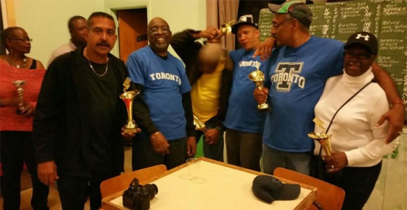 The Scarborough Dominoes Club (SDC) players in a celebratory mood following their victory in Montreal last October.